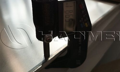 The thickness of a marine grade aluminium sheet is measured.jpg